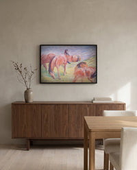 Grazing Horses I by Franz Marc in a black frame above a walnut sideboard in a dining room