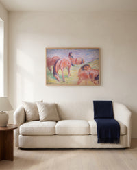 Grazing Horses I by Franz Marc framed in natural oak above a cream sofa in a warm living room