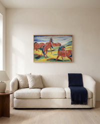 Grazing Horses III by Franz Marc framed in natural oak above a cream sofa in a warm living room