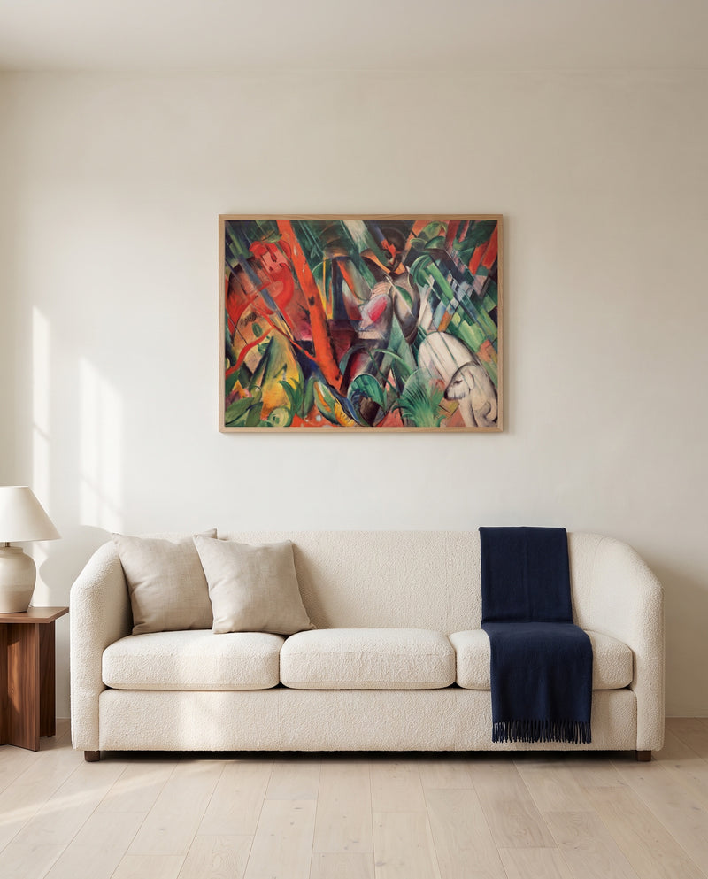 In the Rain by Franz Marc framed in natural oak above a cream sofa in a warm living room