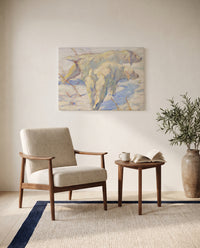 Siberian Dogs in the Snow by Franz Marc as a stretched canvas above a linen lounge chair in a reading corner
