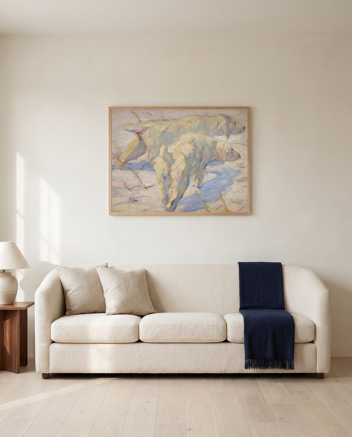 Siberian Dogs in the Snow by Franz Marc framed in natural oak above a cream sofa in a warm living room