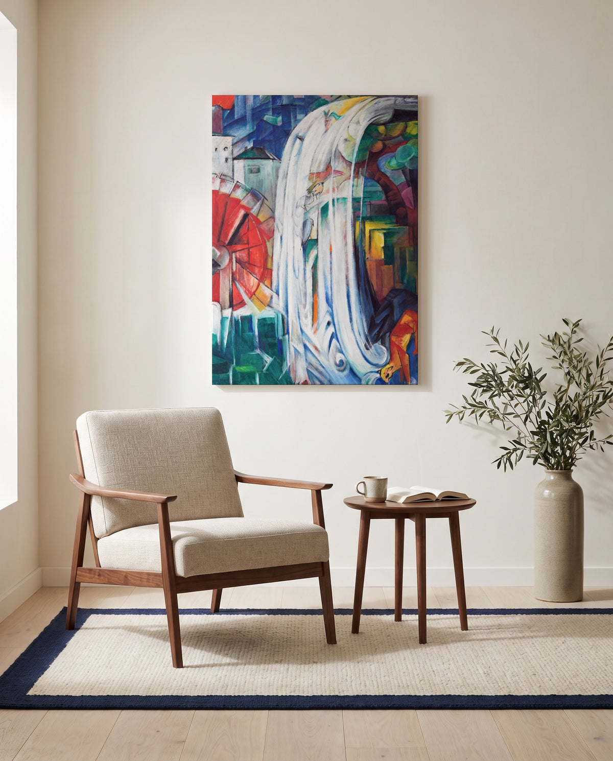 The Bewitched Mill by Franz Marc as a stretched canvas above a linen lounge chair in a reading corner