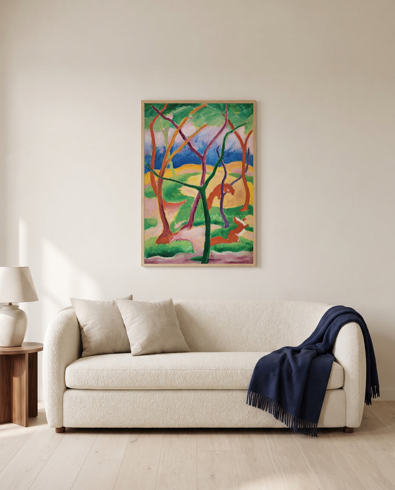 Weasels at Play by Franz Marc framed in natural oak above a cream sofa in a warm living room