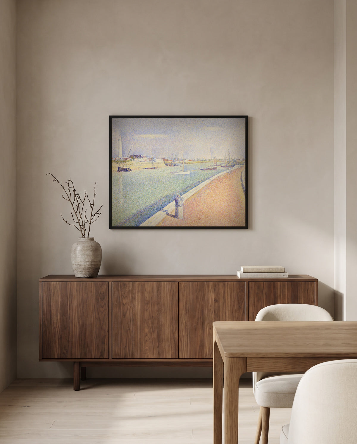 The Channel of Gravelines by Georges Seurat in a black frame above a walnut sideboard in a dining room