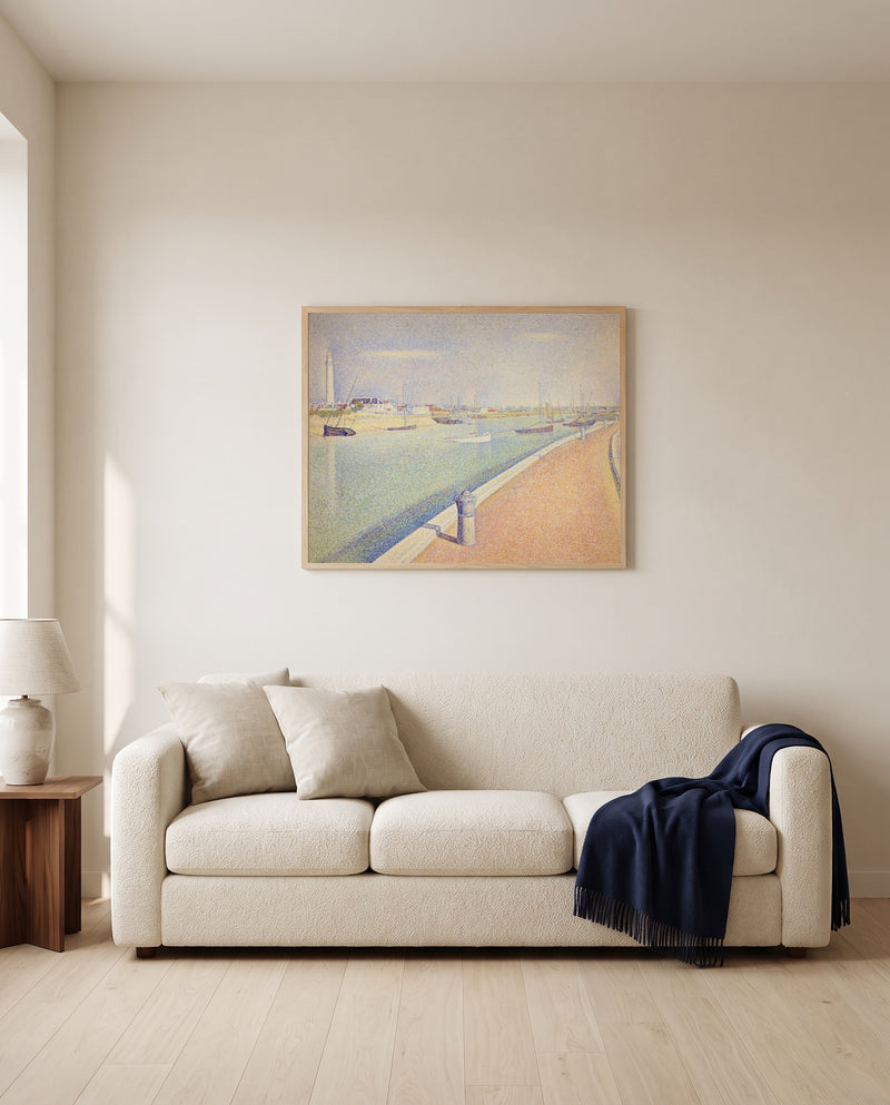The Channel of Gravelines by Georges Seurat framed in natural oak above a cream sofa in a warm living room