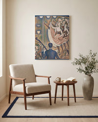 Le Chahut by Georges Seurat as a stretched canvas above a linen lounge chair in a reading corner