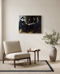 Four Guild Officers by Gerbrand van den Eeckhout as a stretched canvas above a linen lounge chair in a reading corner