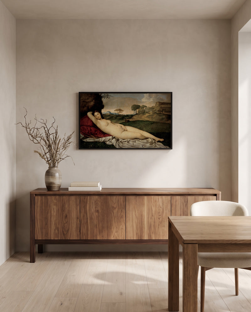 Sleeping Venus by Giorgione in a black frame above a walnut sideboard in a dining room