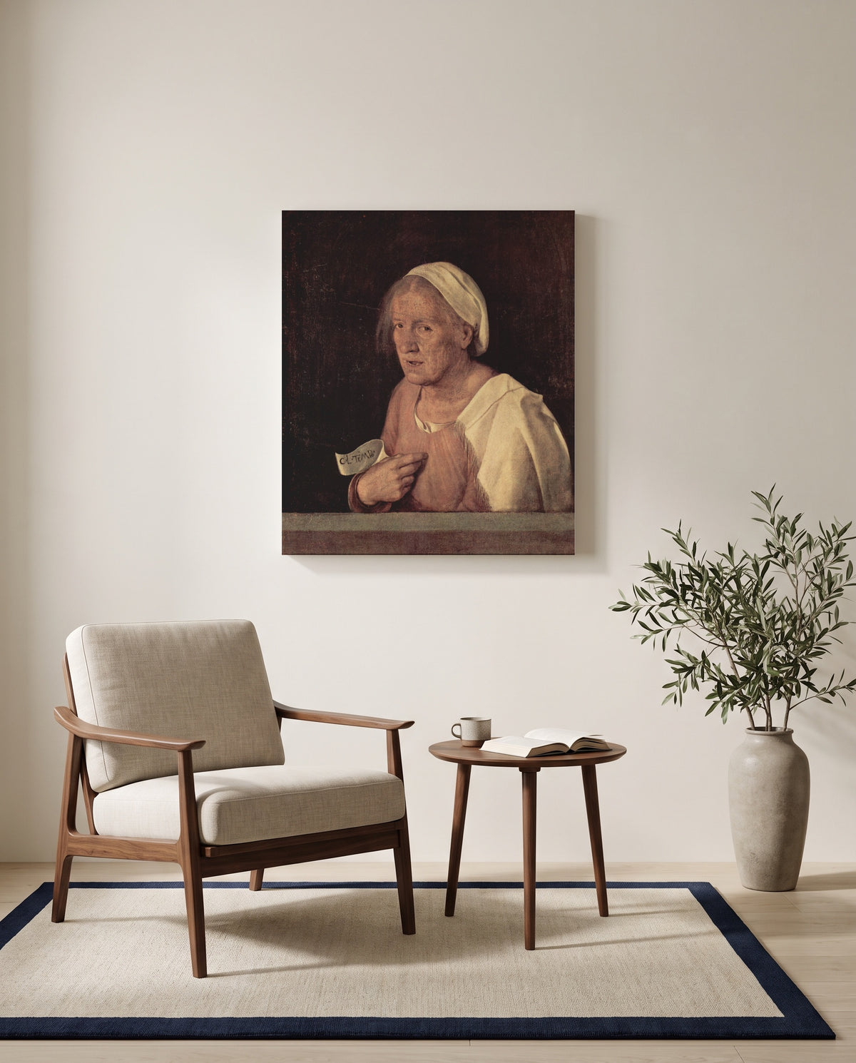 The Old Woman by Giorgione as a stretched canvas above a linen lounge chair in a reading corner