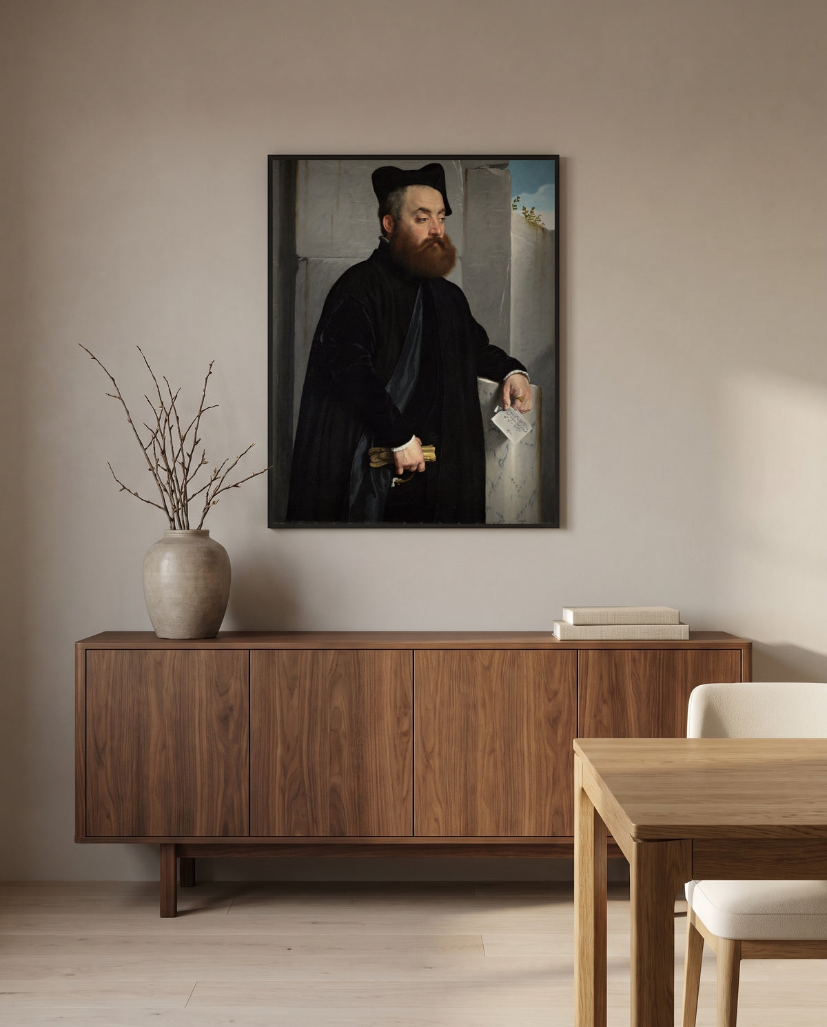 Canon Ludovico di Terzi by Giovanni Battista Moroni in a black frame above a walnut sideboard in a dining room