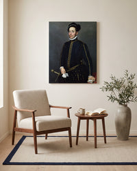 Left-Handed Gentleman by Giovanni Battista Moroni as a stretched canvas above a linen lounge chair in a reading corner