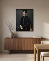 Left-Handed Gentleman by Giovanni Battista Moroni in a black frame above a walnut sideboard in a dining room
