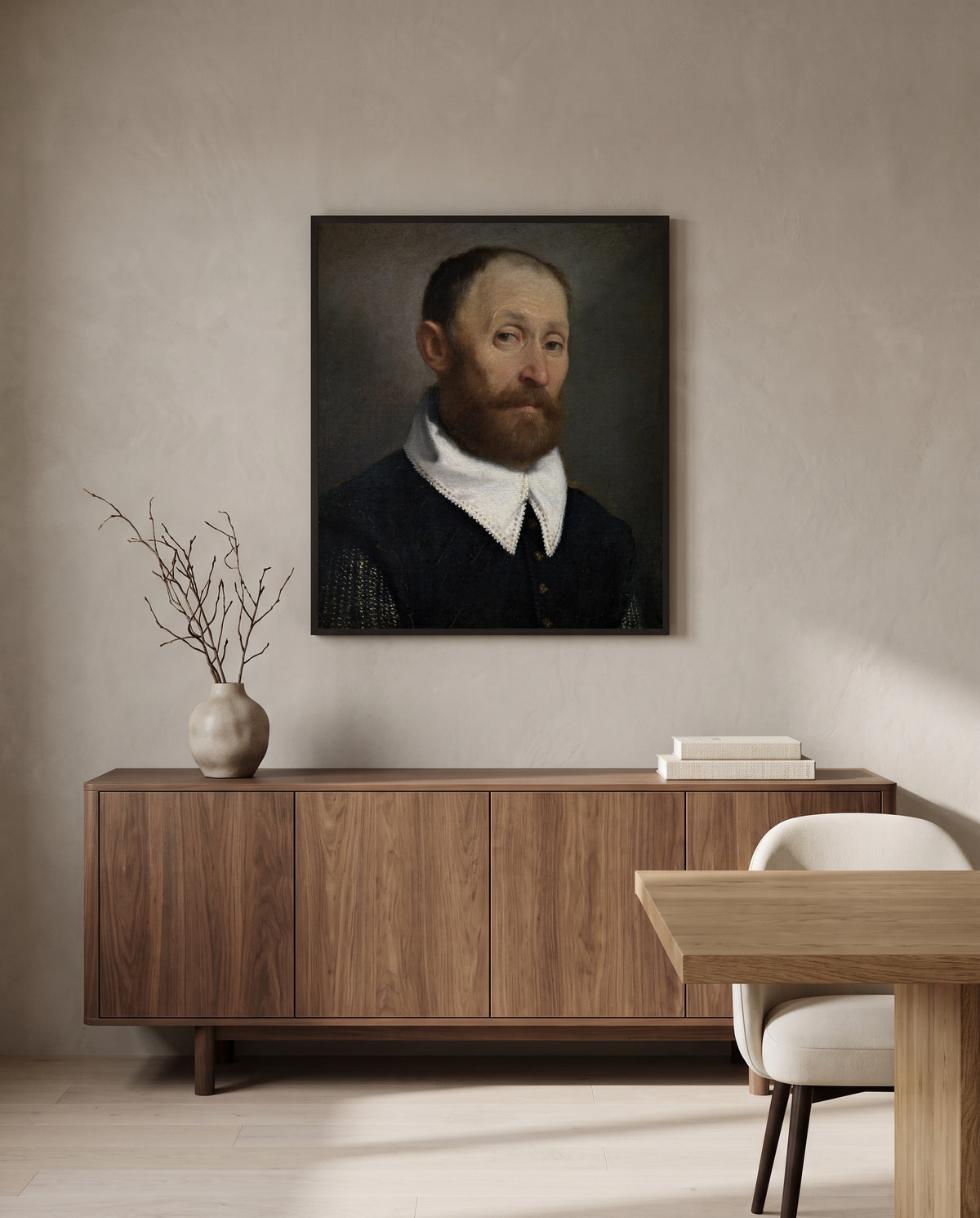 Man with Raised Eyebrows by Giovanni Battista Moroni in a black frame above a walnut sideboard in a dining room