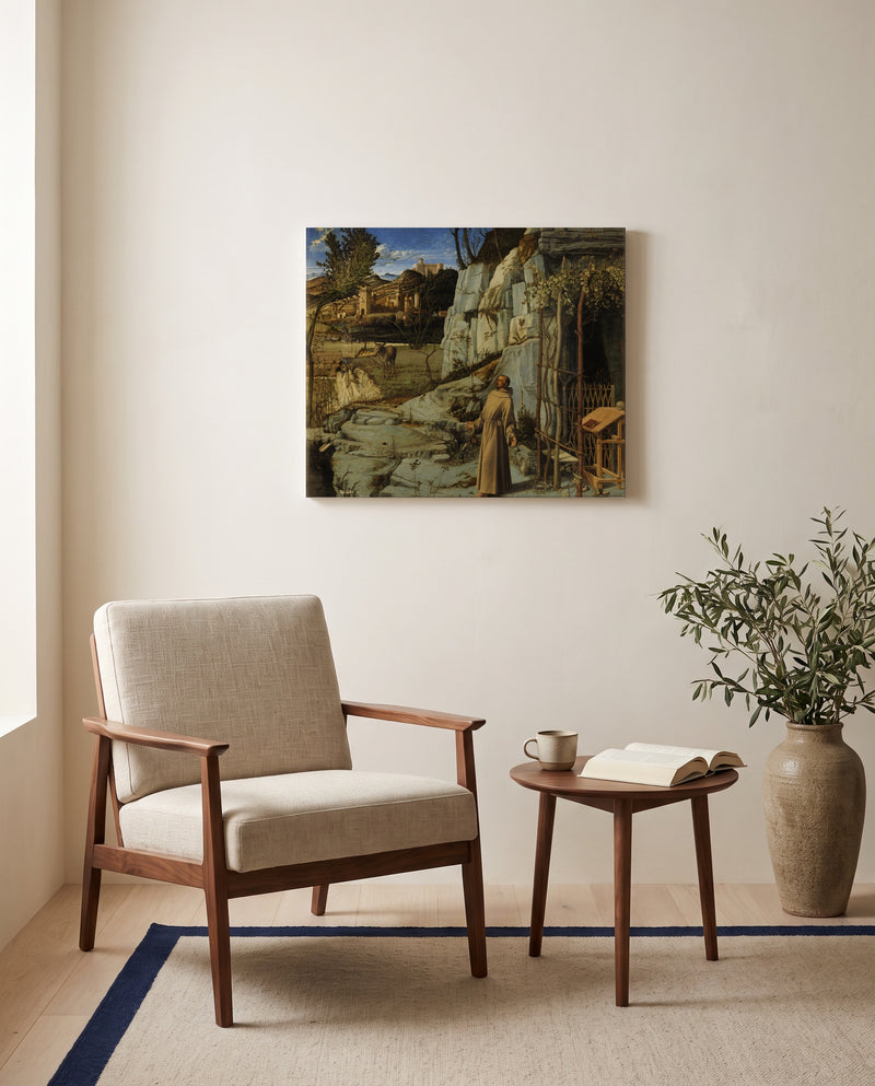 St Francis in the Desert by Giovanni Bellini as a stretched canvas above a linen lounge chair in a reading corner