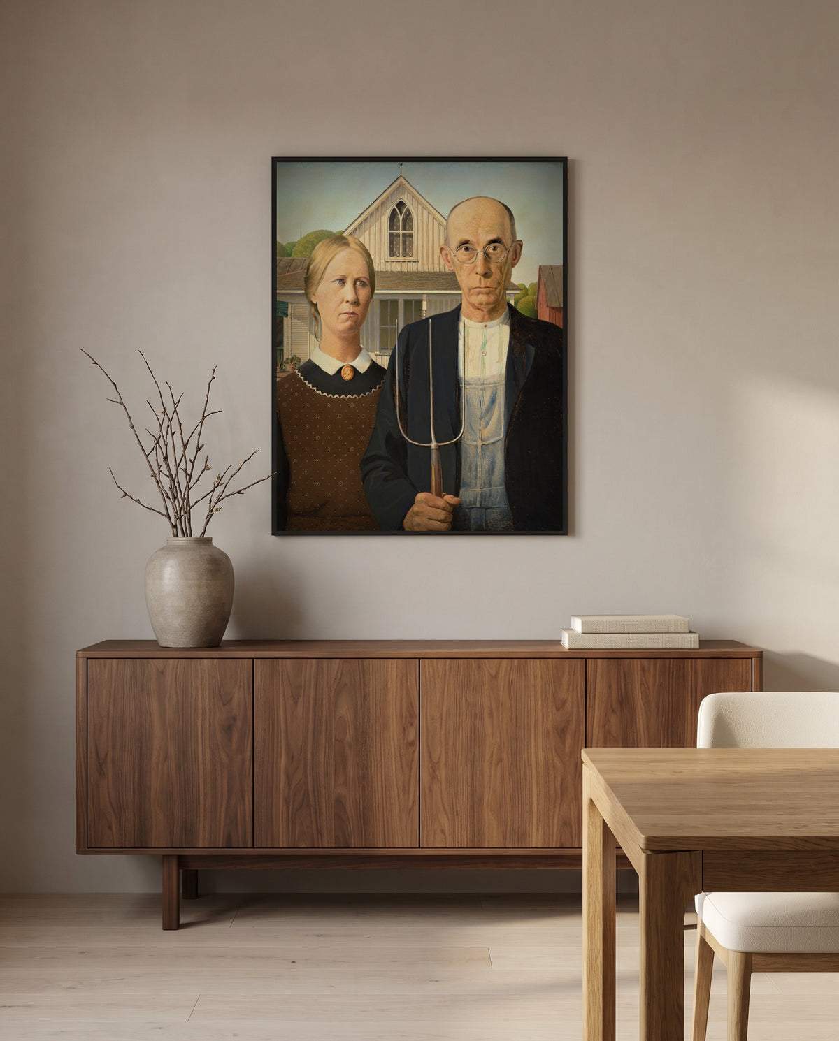 American Gothic by Grant Wood in a black frame above a walnut sideboard in a dining room