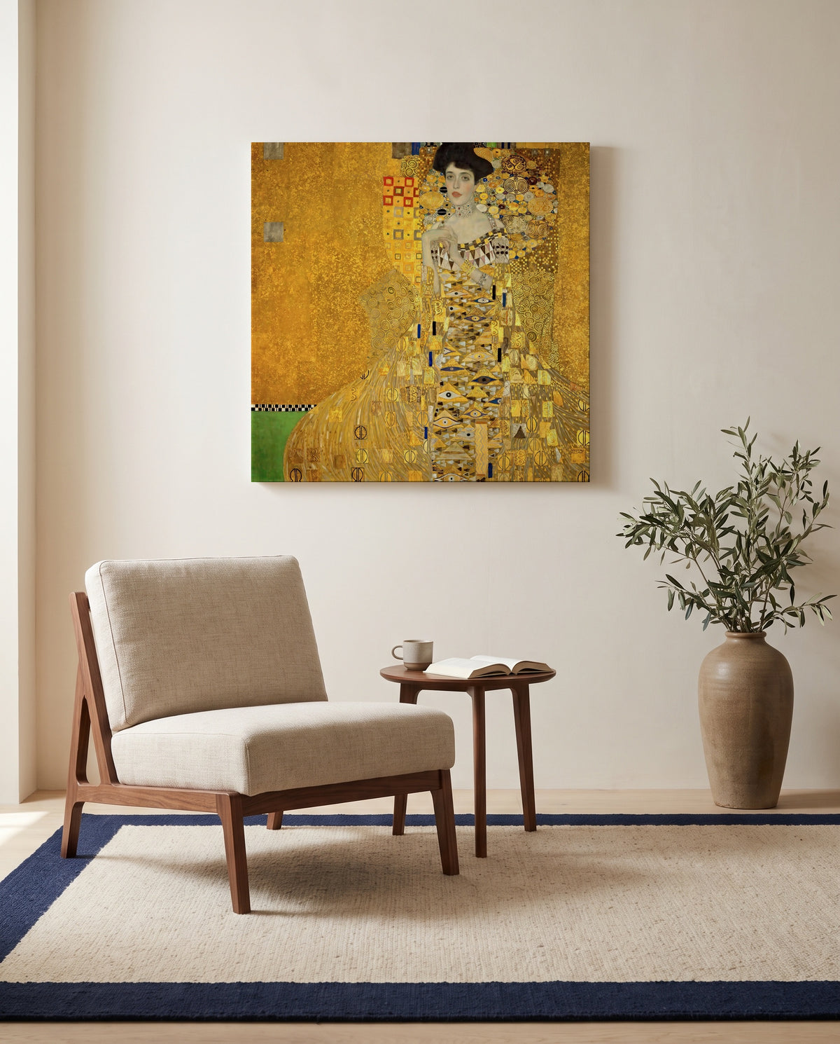 Adele Bloch-Bauer I by Gustav Klimt as a stretched canvas above a linen lounge chair in a reading corner