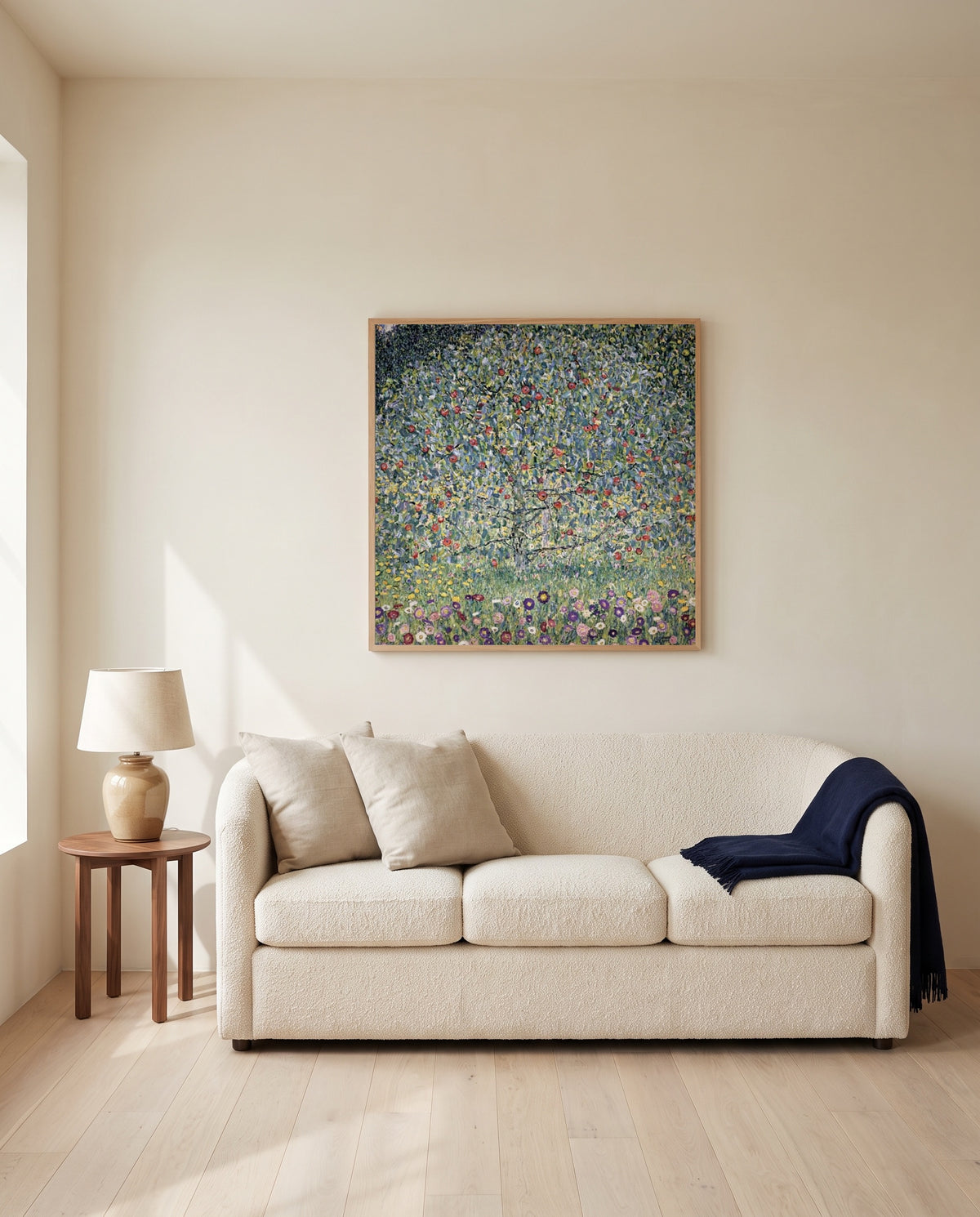 Apple Tree I by Gustav Klimt framed in natural oak above a cream sofa in a warm living room