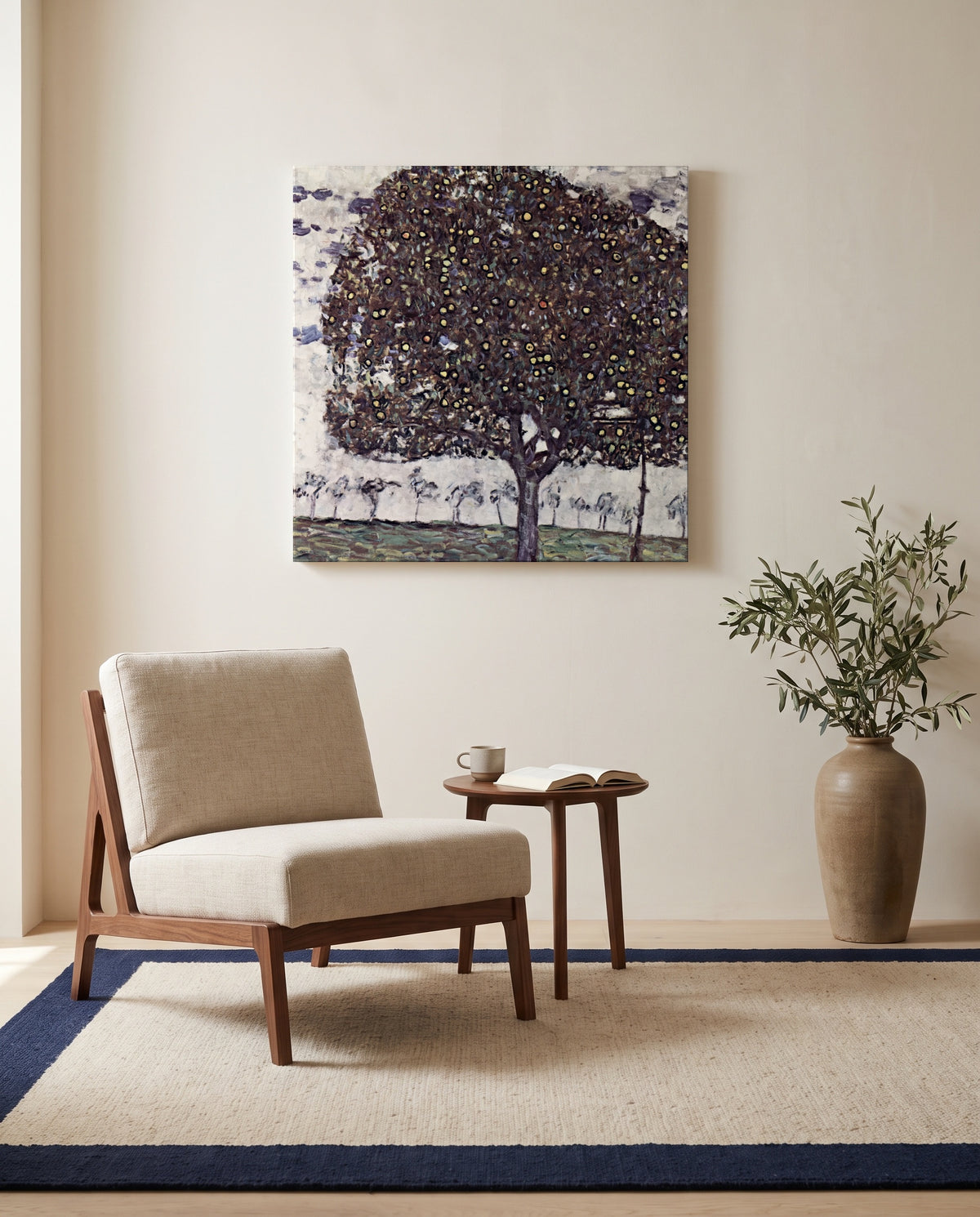 Apple Tree II by Gustav Klimt as a stretched canvas above a linen lounge chair in a reading corner