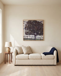 Apple Tree II by Gustav Klimt framed in natural oak above a cream sofa in a warm living room