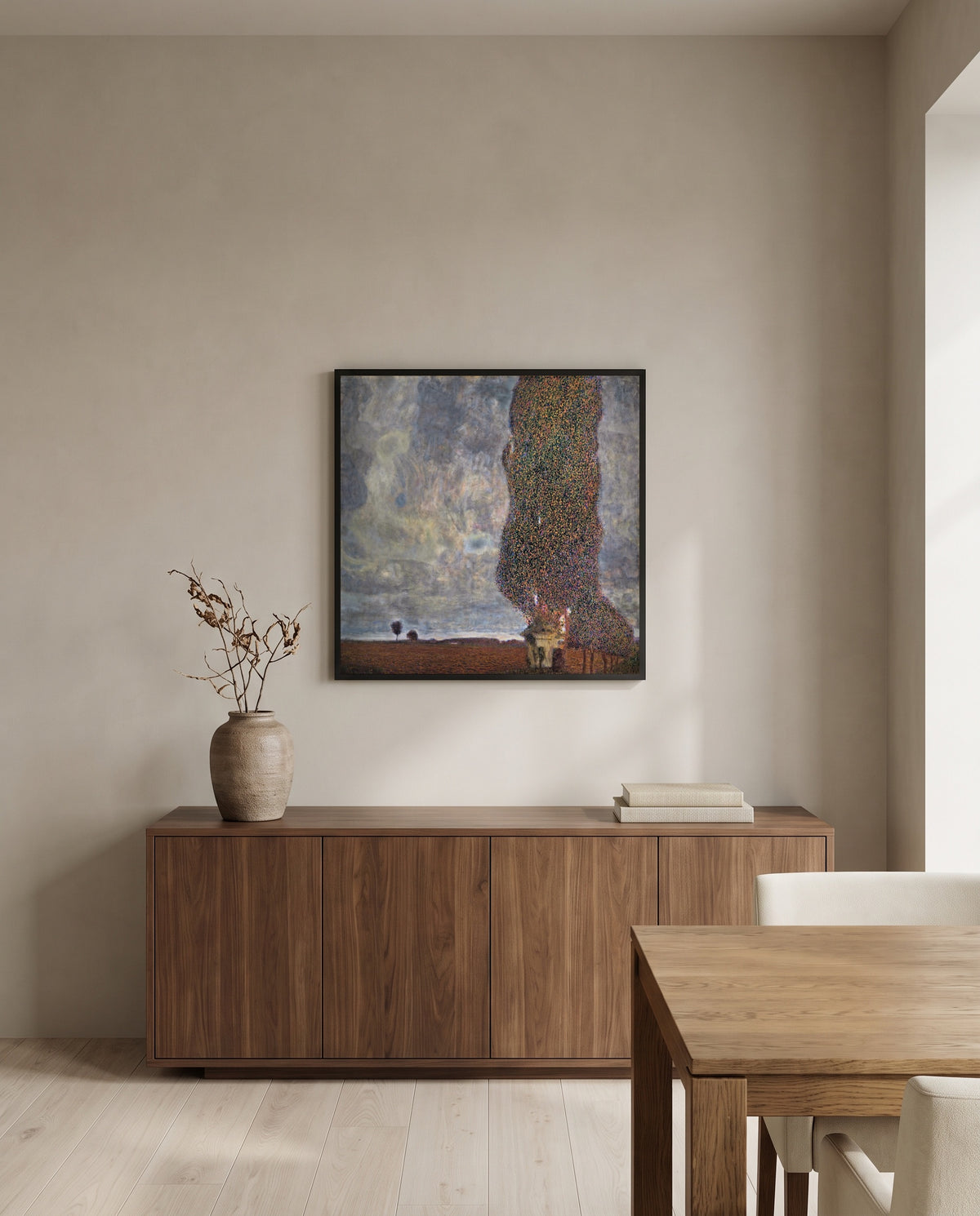 Approaching Thunderstorm by Gustav Klimt in a black frame above a walnut sideboard in a dining room