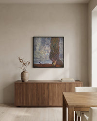 Approaching Thunderstorm by Gustav Klimt in a black frame above a walnut sideboard in a dining room