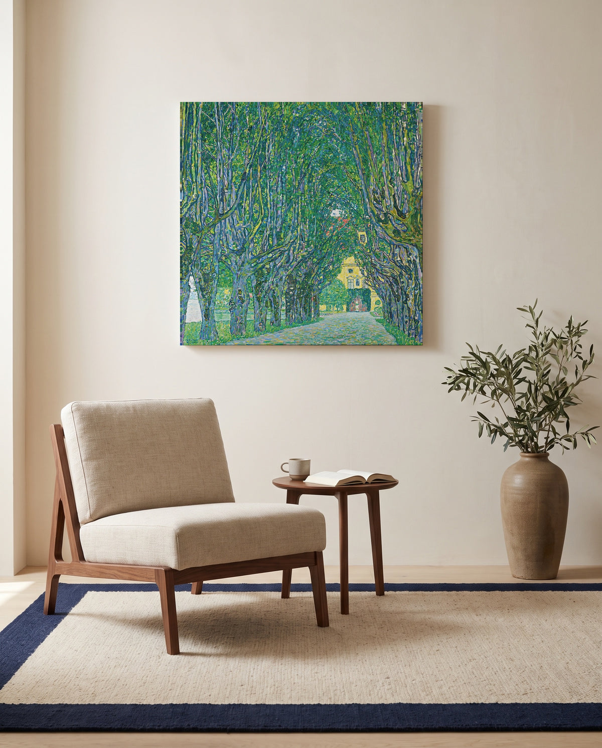 Avenue to Schloss Kammer by Gustav Klimt as a stretched canvas above a linen lounge chair in a reading corner