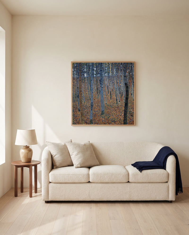 Beech Grove I by Gustav Klimt framed in natural oak above a cream sofa in a warm living room