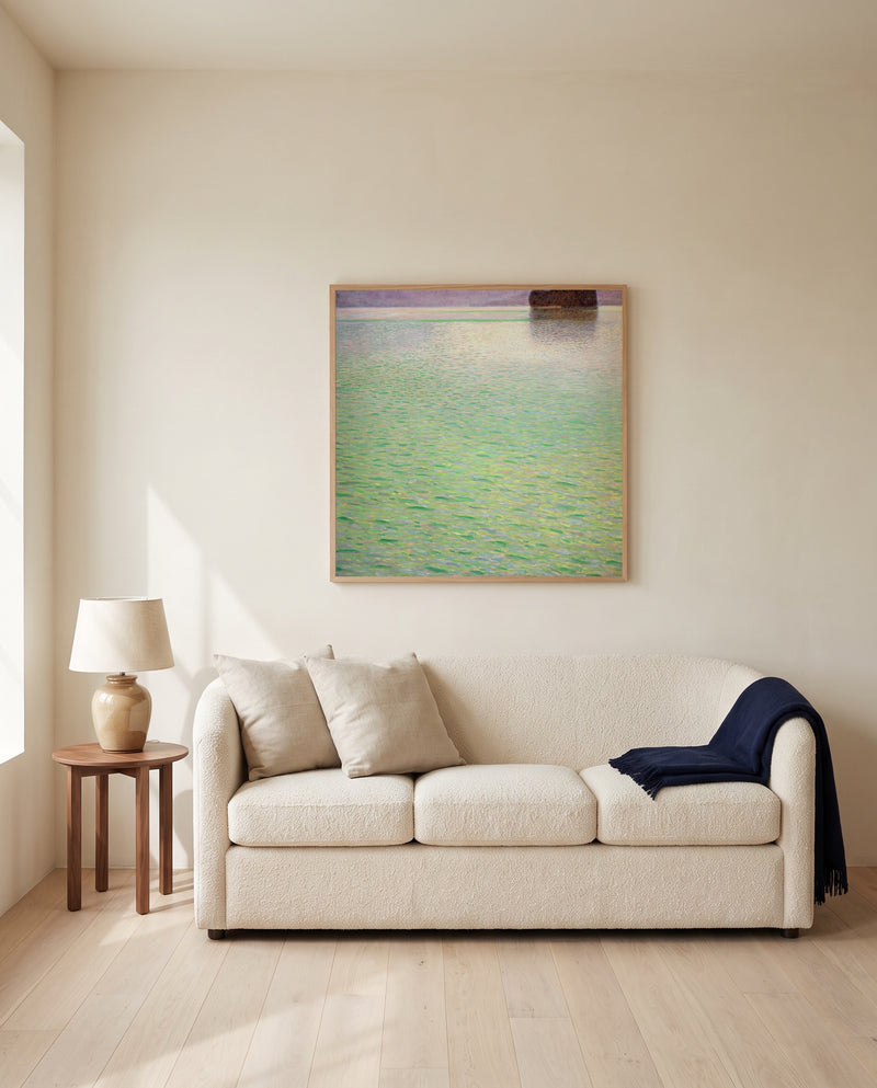 Insel im Attersee by Gustav Klimt framed in natural oak above a cream sofa in a warm living room
