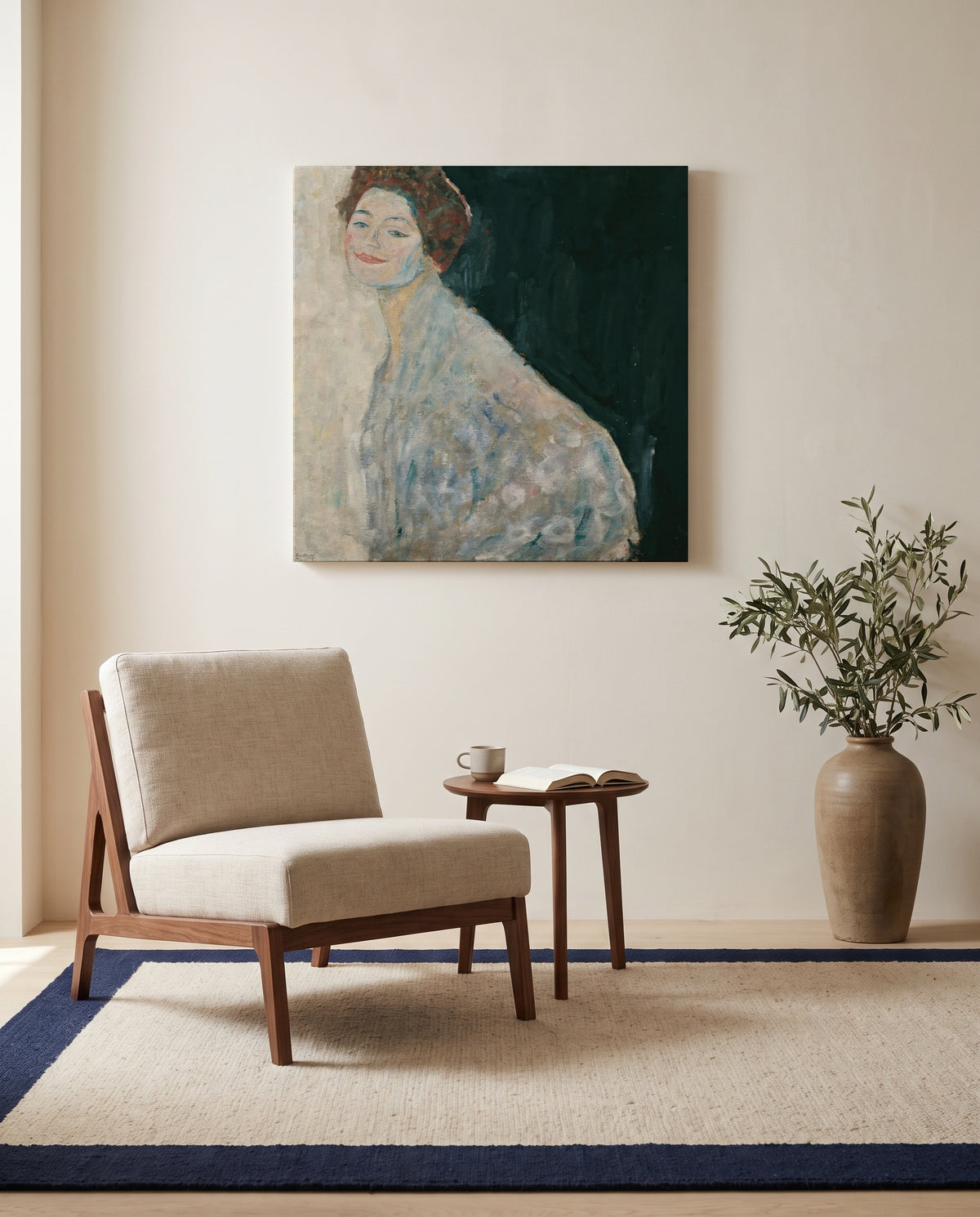 Lady in White by Gustav Klimt as a stretched canvas above a linen lounge chair in a reading corner