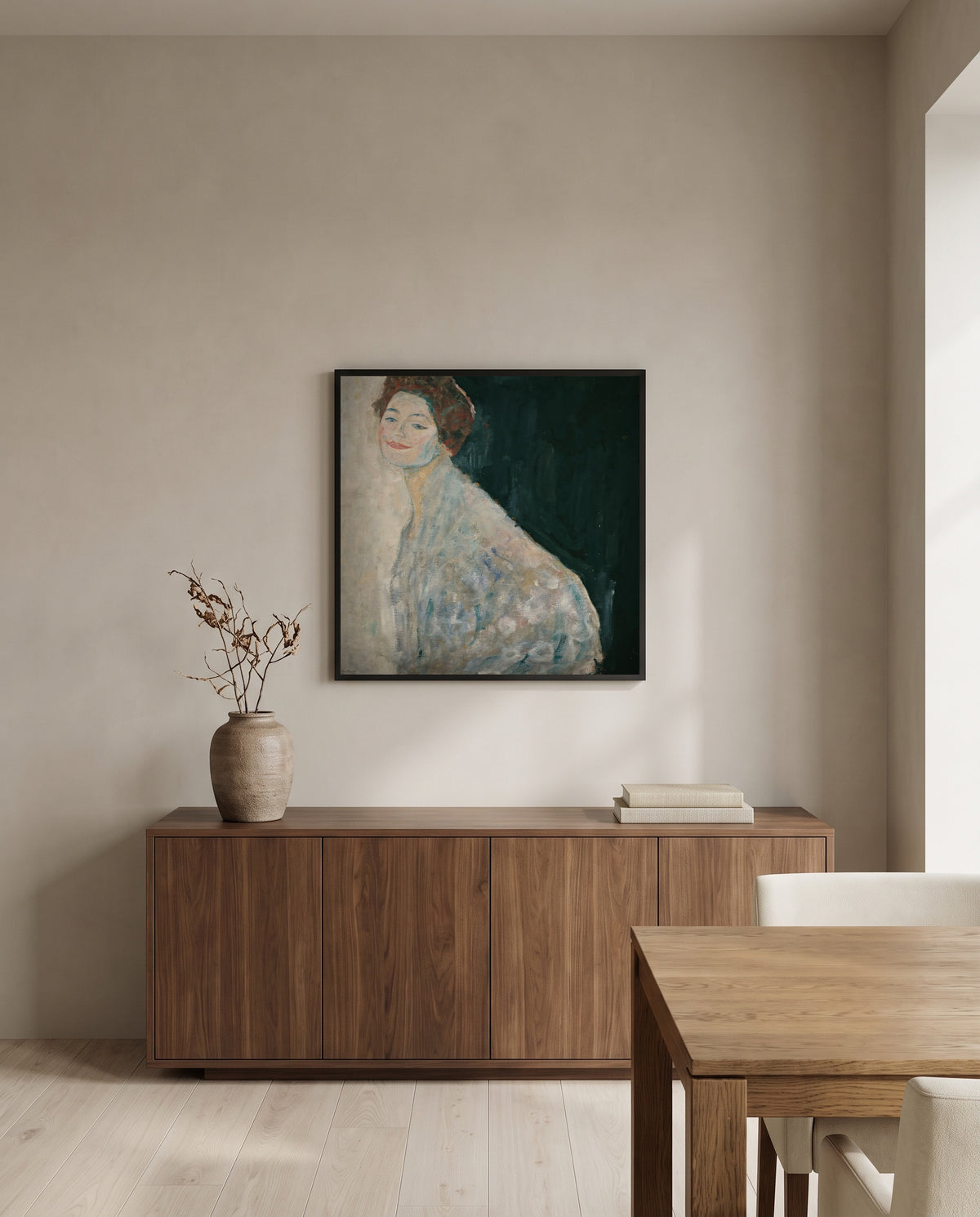 Lady in White by Gustav Klimt in a black frame above a walnut sideboard in a dining room