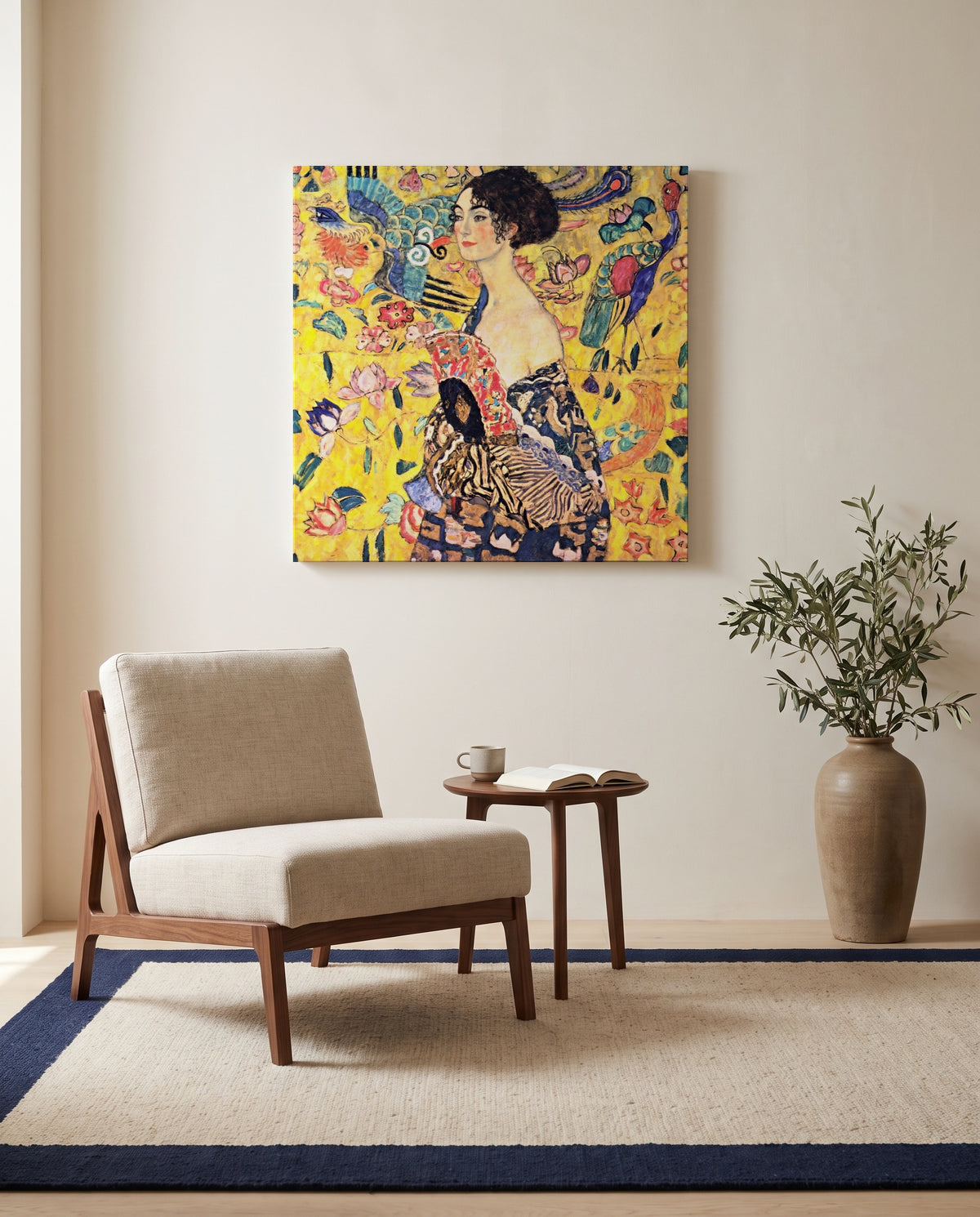 Lady with a Fan by Gustav Klimt as a stretched canvas above a linen lounge chair in a reading corner