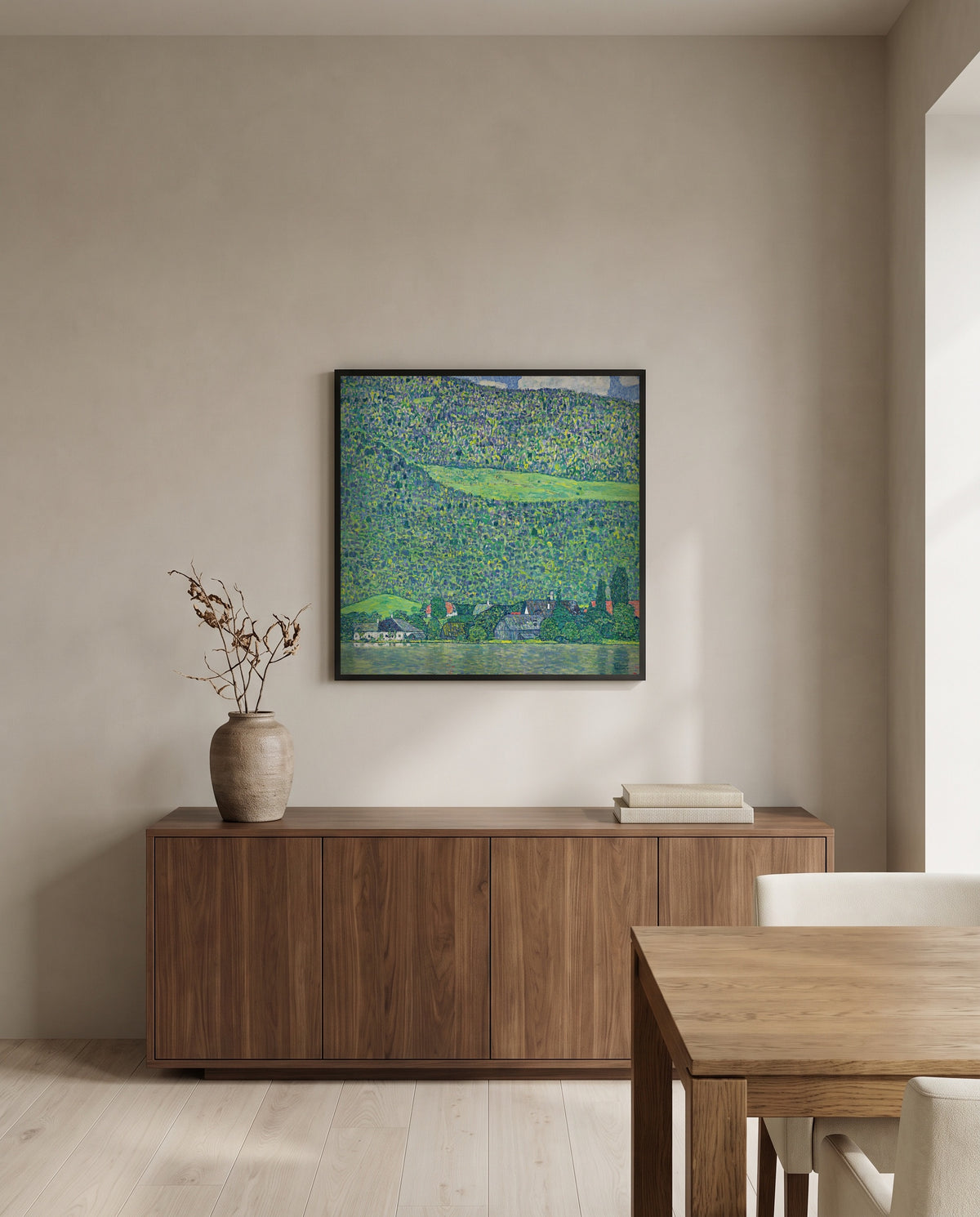 Litzlberg on the Attersee by Gustav Klimt in a black frame above a walnut sideboard in a dining room