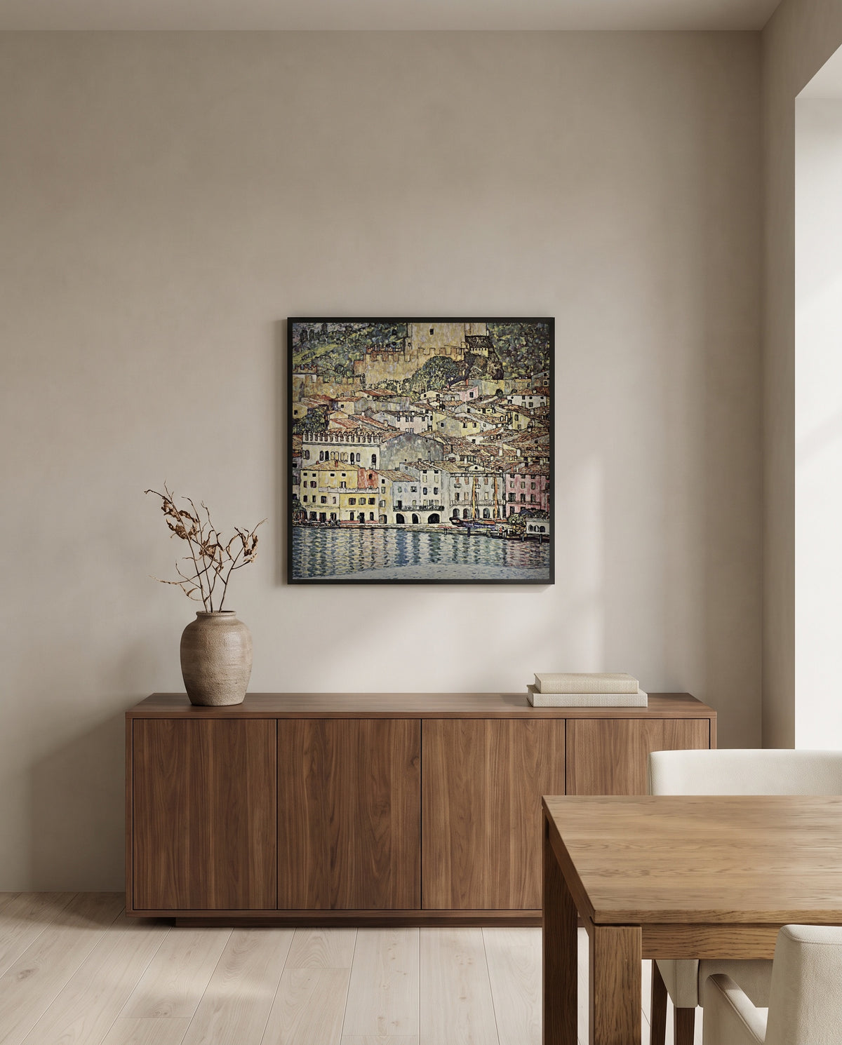 Malcesine on Lake Garda by Gustav Klimt in a black frame above a walnut sideboard in a dining room