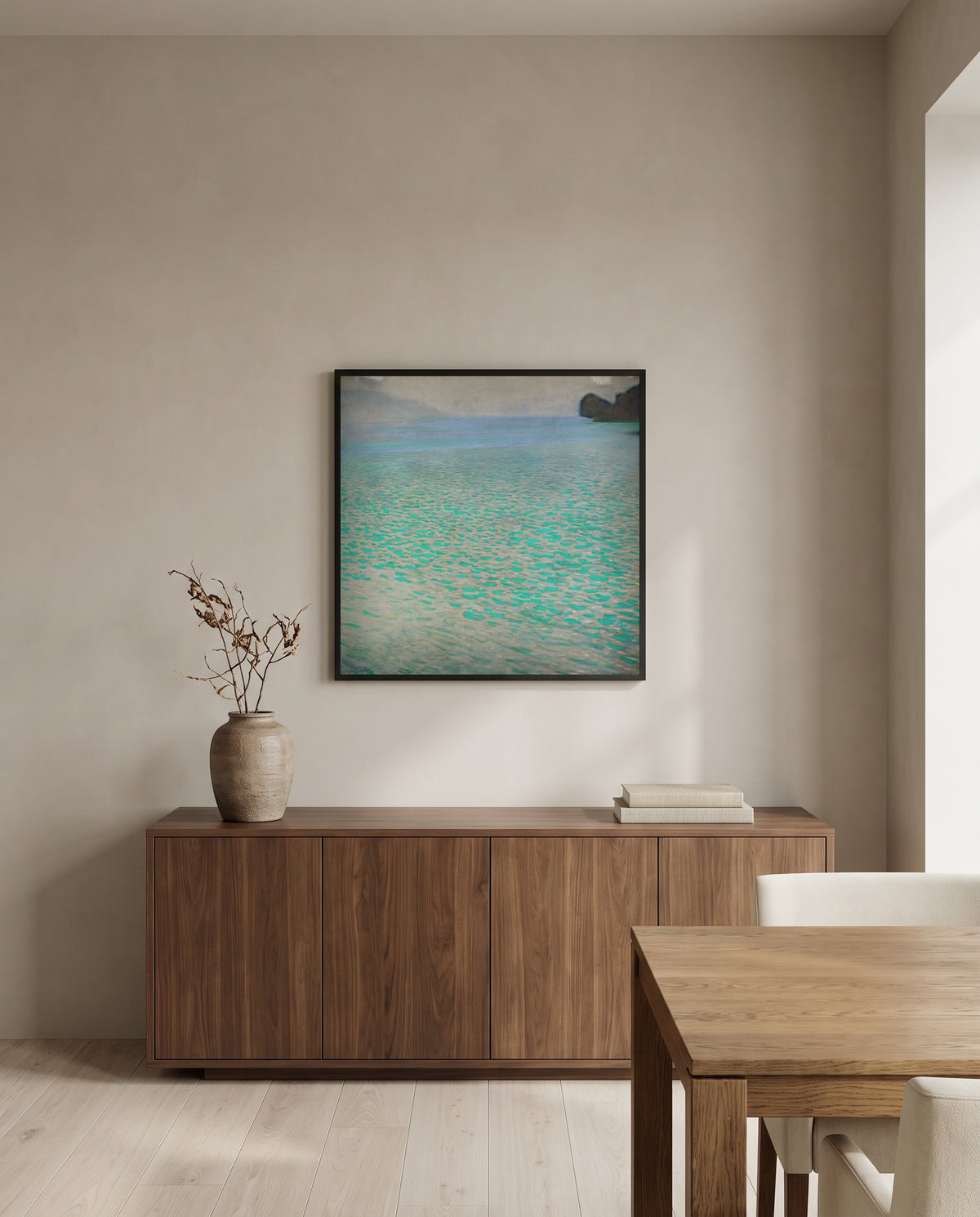 On Lake Attersee by Gustav Klimt in a black frame above a walnut sideboard in a dining room
