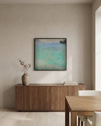 On Lake Attersee by Gustav Klimt in a black frame above a walnut sideboard in a dining room