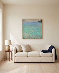 On Lake Attersee by Gustav Klimt framed in natural oak above a cream sofa in a warm living room