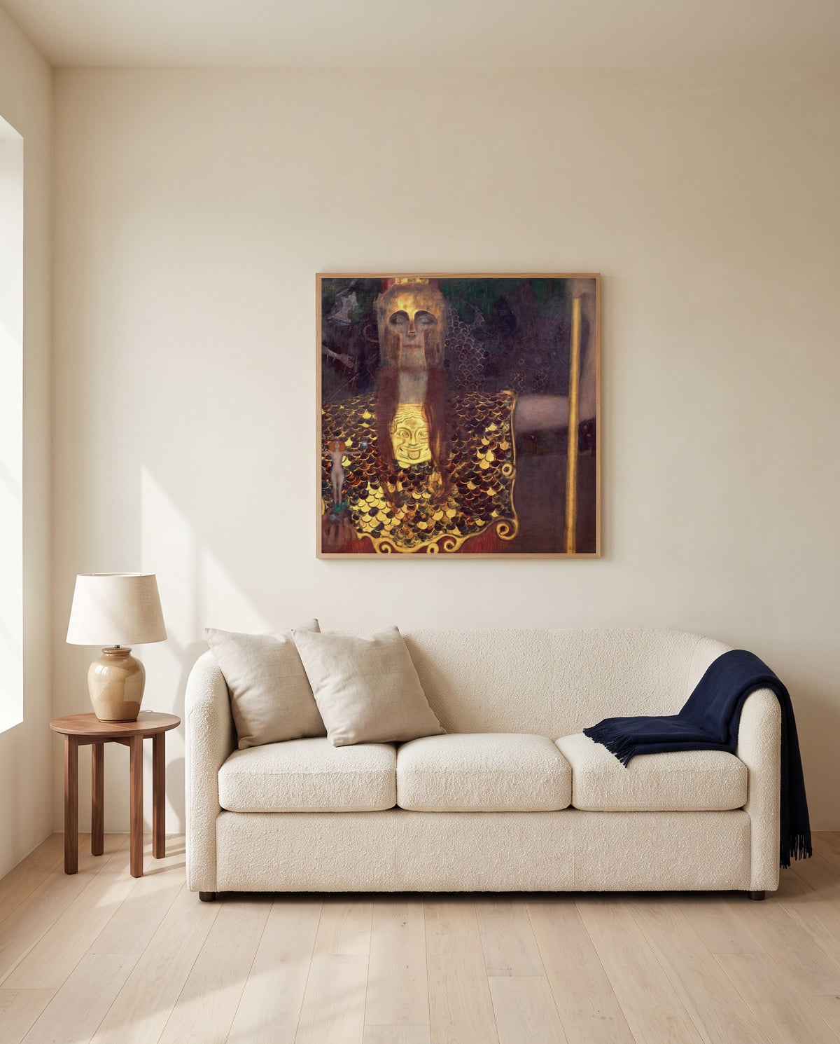 Pallas Athena by Gustav Klimt framed in natural oak above a cream sofa in a warm living room