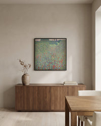 Poppy Field by Gustav Klimt in a black frame above a walnut sideboard in a dining room