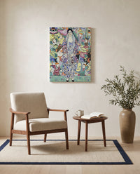 Friederike Maria Beer by Gustav Klimt as a stretched canvas above a linen lounge chair in a reading corner