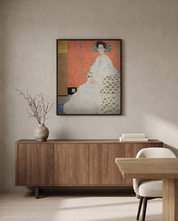 Fritza Riedler by Gustav Klimt in a black frame above a walnut sideboard in a dining room