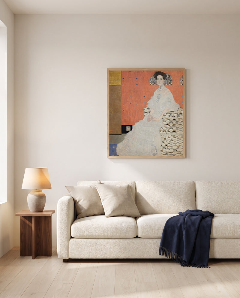 Fritza Riedler by Gustav Klimt framed in natural oak above a cream sofa in a warm living room