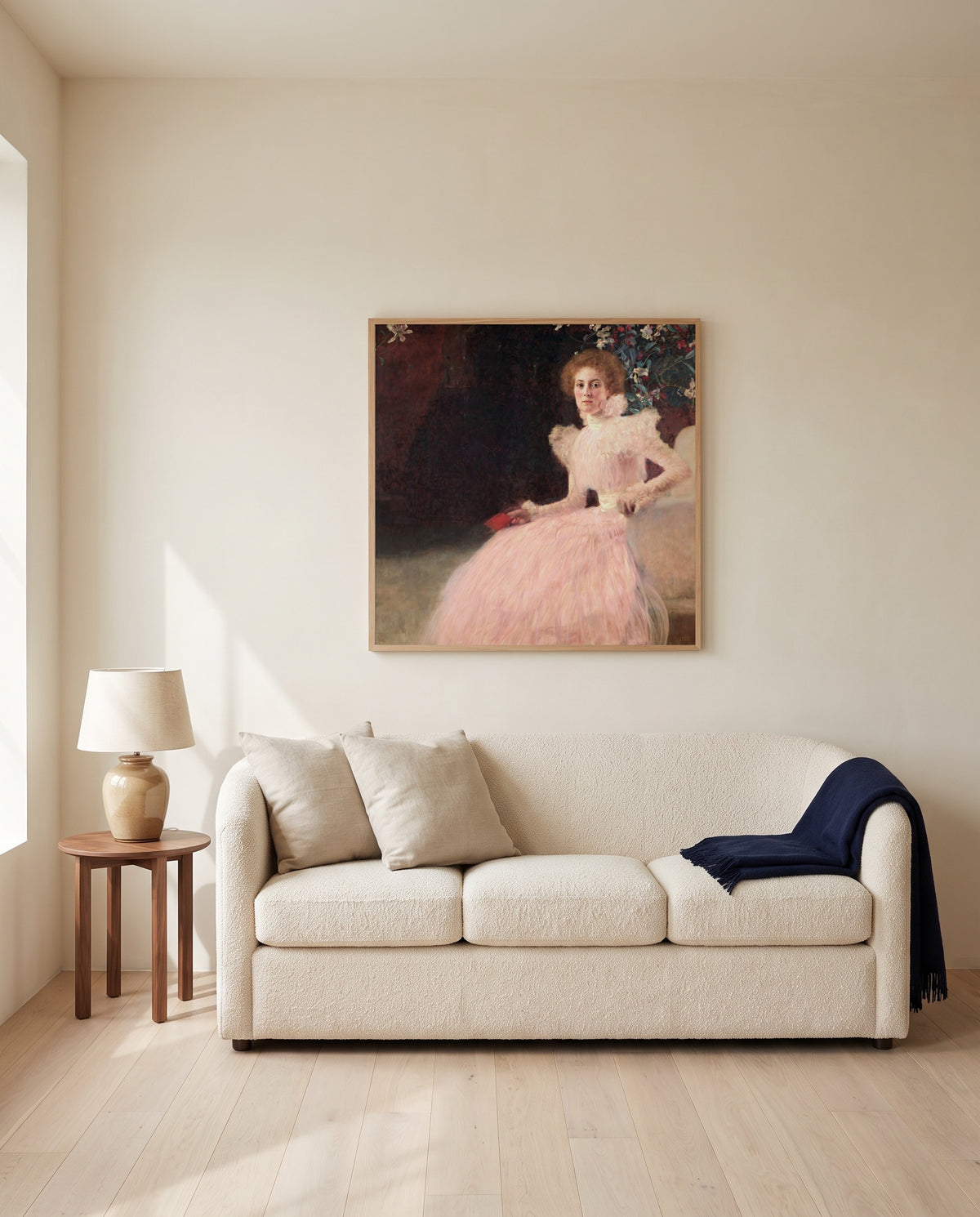 Sonja Knips by Gustav Klimt framed in natural oak above a cream sofa in a warm living room