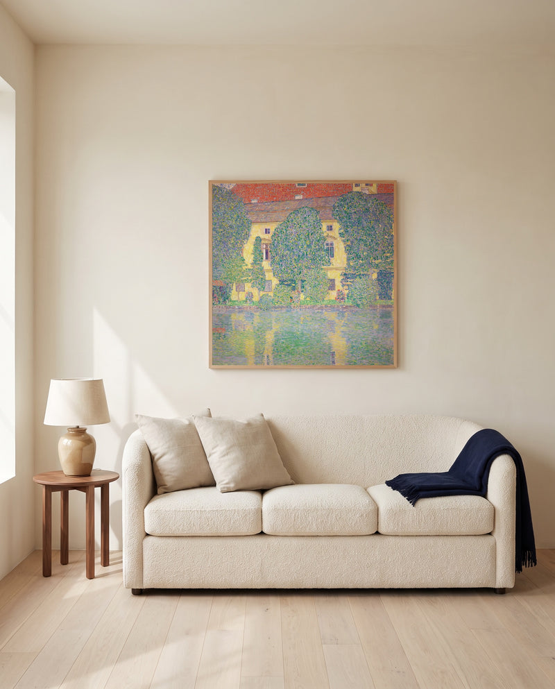 Schloss Kammer III by Gustav Klimt framed in natural oak above a cream sofa in a warm living room