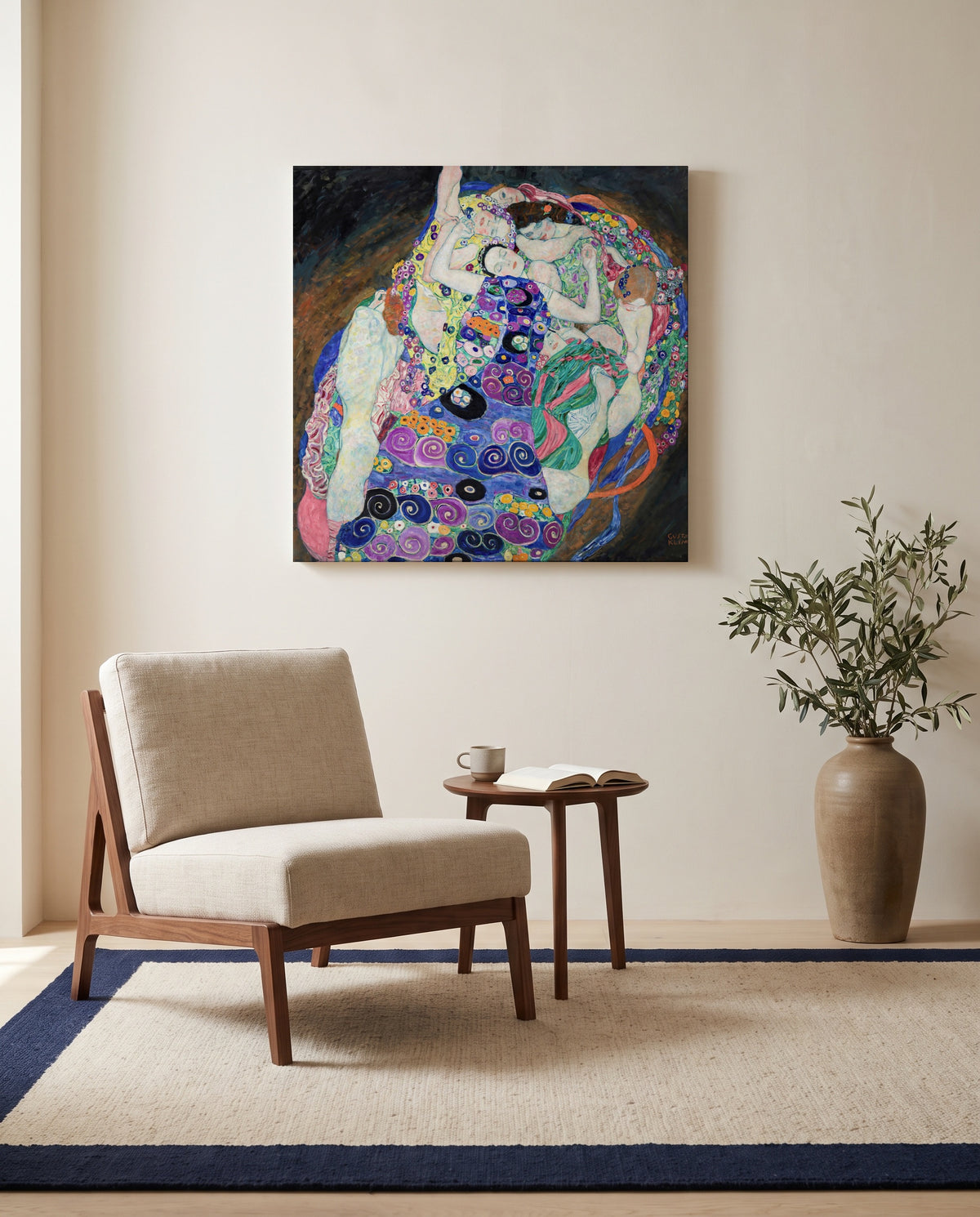 The Maiden by Gustav Klimt as a stretched canvas above a linen lounge chair in a reading corner