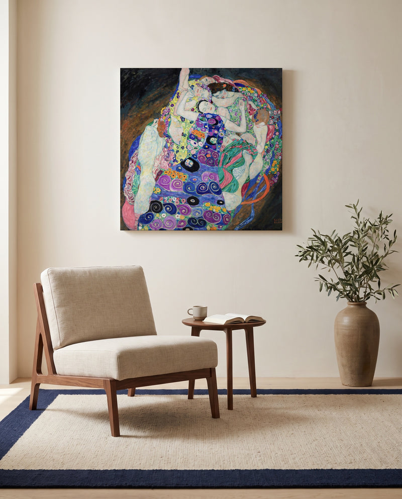 The Maiden by Gustav Klimt as a stretched canvas above a linen lounge chair in a reading corner