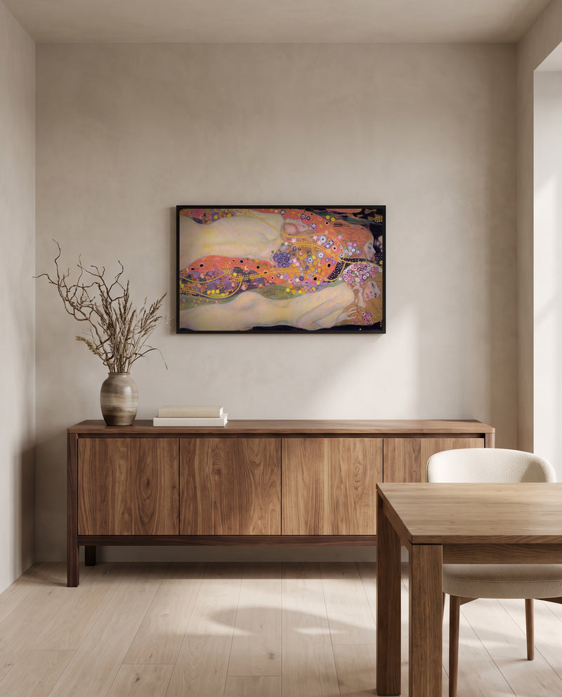 Water Serpents II by Gustav Klimt in a black frame above a walnut sideboard in a dining room