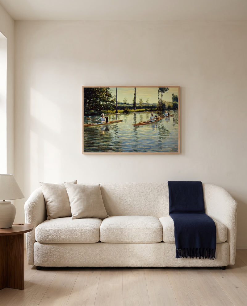 Boating on the Yerres by Gustave Caillebotte framed in natural oak above a cream sofa in a warm living room