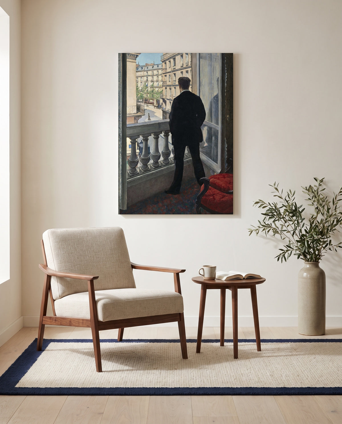 Young Man at His Window by Gustave Caillebotte as a stretched canvas above a linen lounge chair in a reading corner