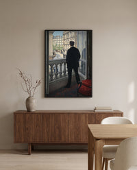 Young Man at His Window by Gustave Caillebotte in a black frame above a walnut sideboard in a dining room